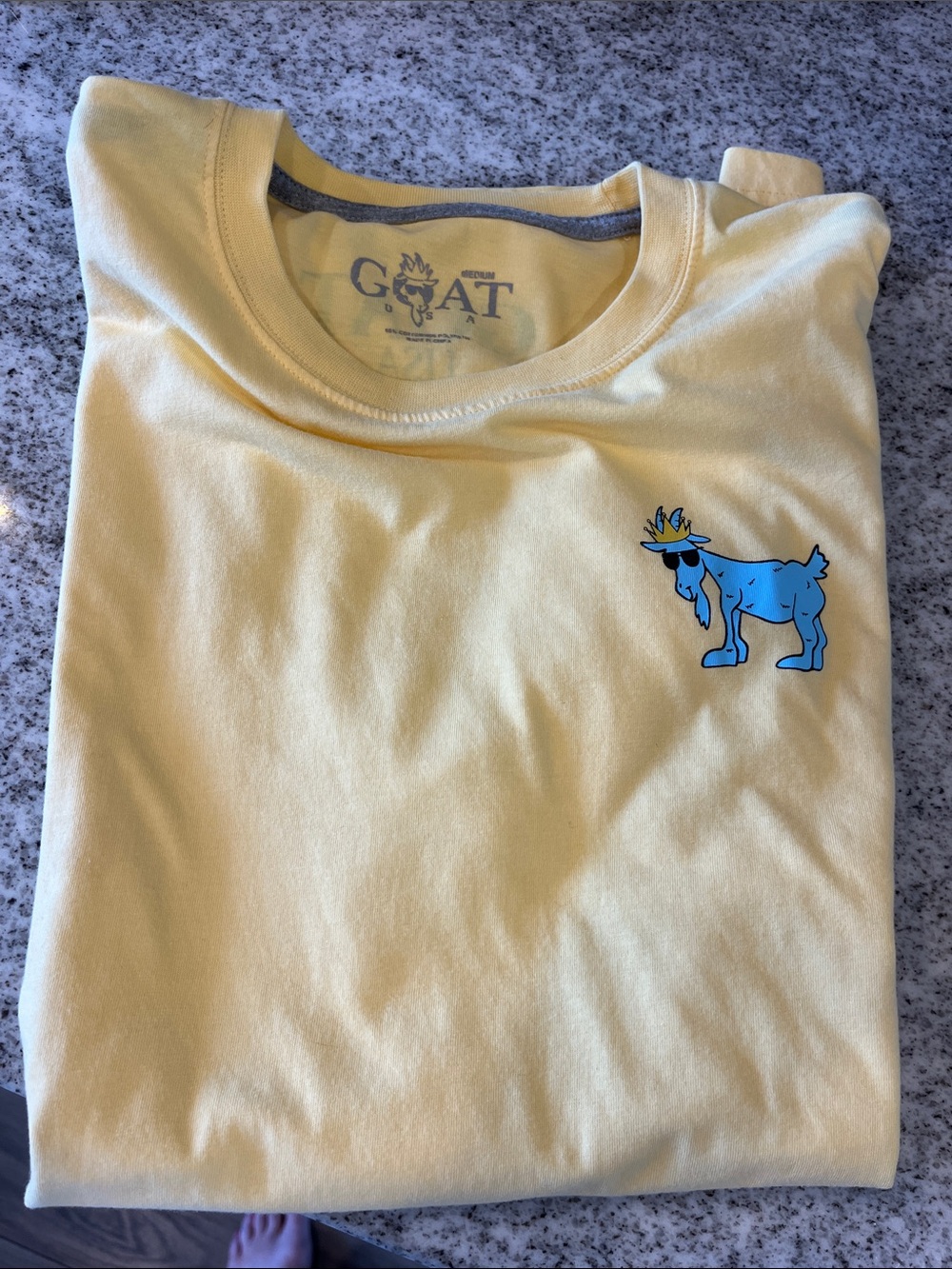 GOAT Men's Short Sleeve Tee in Pale Yellow with Blue Goat Graphic